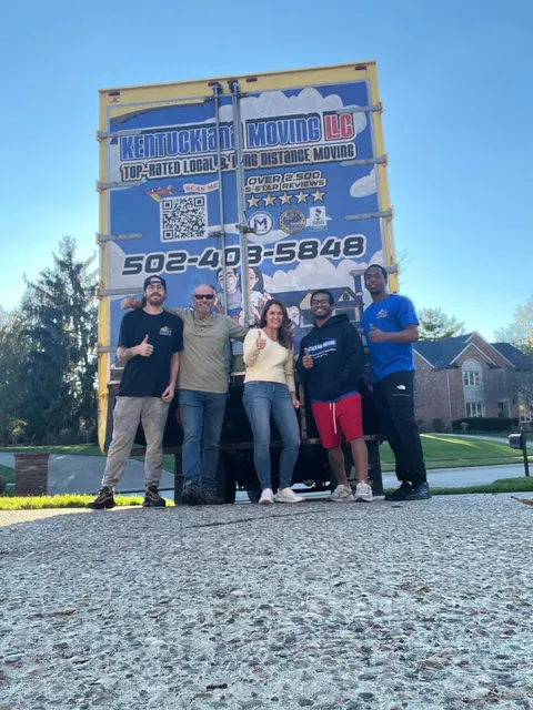 Kentuckiana Moving crew photo with company box trucks